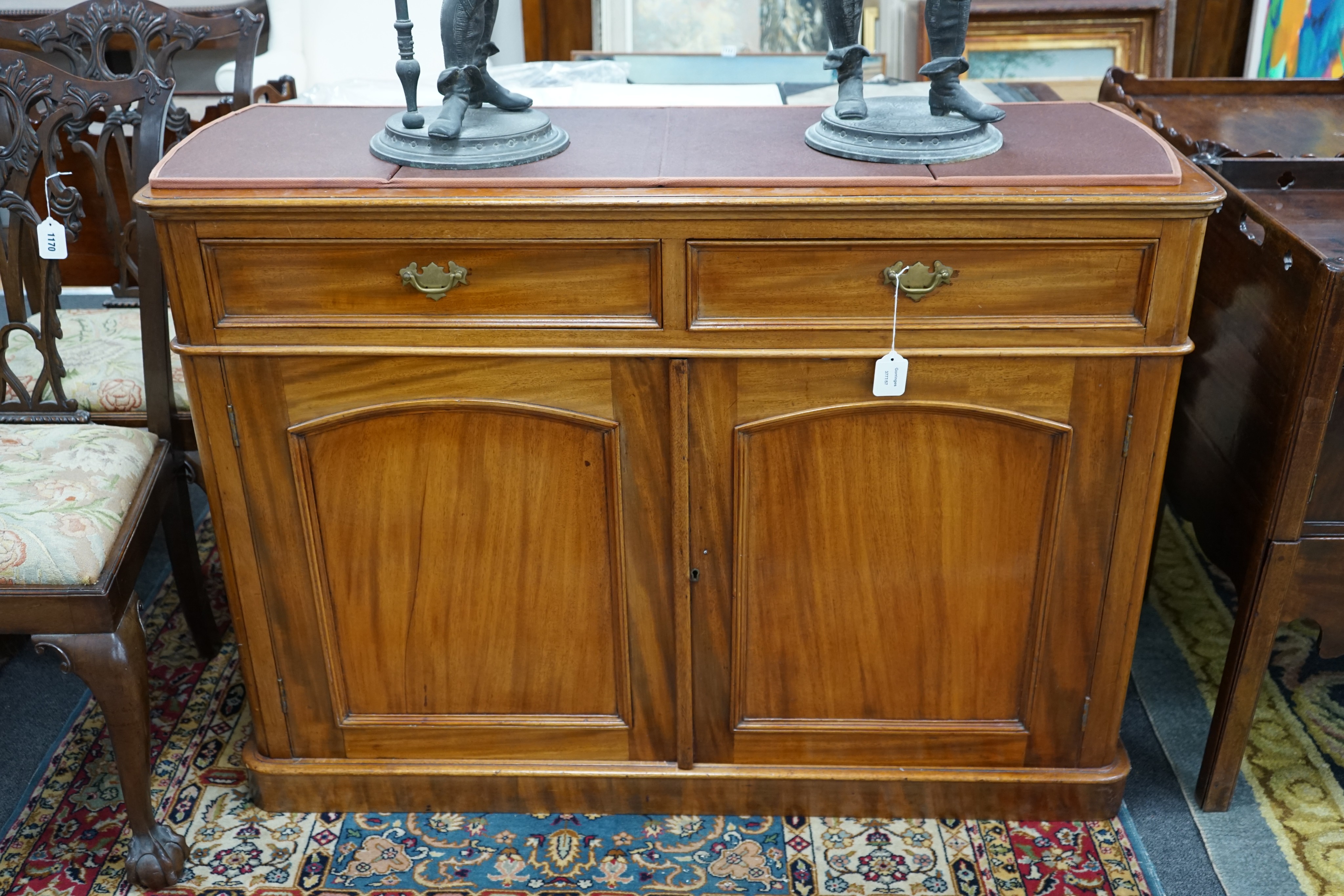 A Victorian mahogany side cabinet with two drawers over a pair of panelled doors, width 120cm, depth 44cm, height 87cm